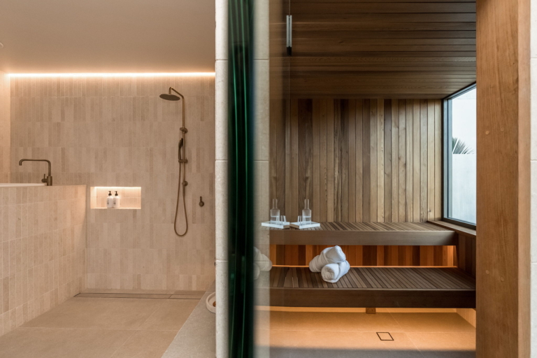 Timber sauna adjoining the limestone wellness pavilion